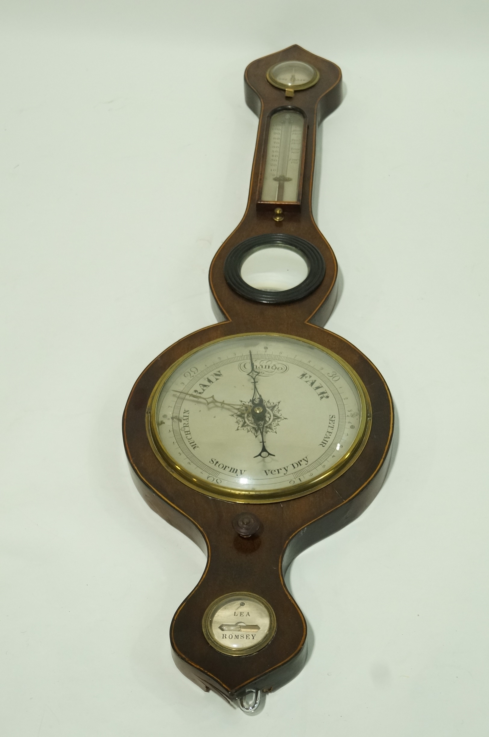 A 19th century mahogany and boxwood strung banjo barometer with silvered dials, named "Lea Romsey",