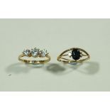 A 9 carat gold sapphire and diamond three stone ring;