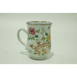 A late 18th century Chinese porcelain tankard, painted with flowering peonies and two crabs,