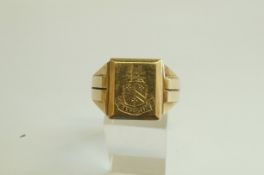 A 9 carat gold signet ring, crested to the rectangular head, finger size V,