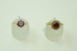A 9 carat gold ruby and illusion set diamond cluster ring;