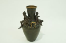 A late 19th century Art Nouveau spelter two handled vase with applied figural mounts,