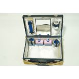 A ladies dressing case with fitted interior and cloth outer case