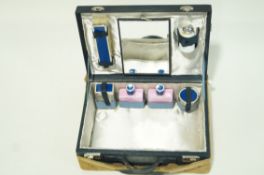 A ladies dressing case with fitted interior and cloth outer case