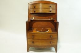A 19th century mahogany bow fronted commode with four faux drawers,