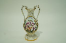 A Capodimonte two handled vase moulded with figures,