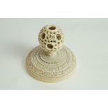 A late 19th century carved ivory Chinese concentric ball on flared stand, 6cm high, stand 6.