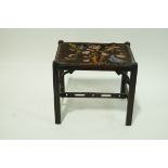An early 20th century rectangular stool with tapestry seat and pierced stretchers, 41cm high,