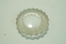 A Lalique ash tray, the rim moulded with frosted, stylised leaves,