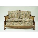 A mahogany framed Bergere suite, with caned backs, double caned arms,