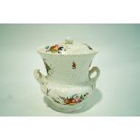 A Coalport two handled ice pale and cover moulded with bouquets of flowers and painted in enamels