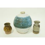 A studio pottery stoneware vase with a central horizontal blue band on white ground,