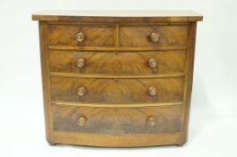 A Victorian mahogany bow fronted chest of two short and three long drawers,