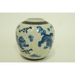 A Chinese crackle glaze ginger jar, decorated in underglaze blue with dogs of Fo,