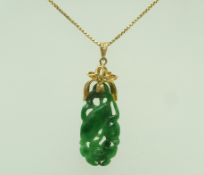 A jade pendant, carved with flora, 3.