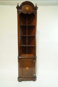 A reproduction inlaid mahogany standing corner cupboard by Banks of Bristol,
