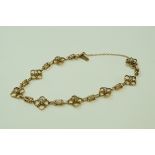 An Edwardian seed pearl set bracelet, stamped '9ct' to the catch, 18 cm long,