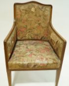 An Edwardian mahogany armchair with show frame,