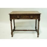A Victorian oak centre table with carved frieze and one frieze drawer with carved mask handles on