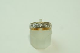 A 9 carat two colour gold patterned wedding ring, finger size J, 3.