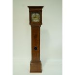 An oak longcase clock with square brass dial, subsidiary second dial and date aperture,