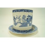 A 19th century pottery stilton dish and cover, transfer printed in blue with the Willow pattern,