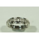 A 9 carat white gold diamond set ring, the brilliant cuts set in four groups of four,