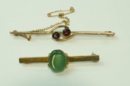 A two stone garnet bar brooch, stamped '9ct', 6.