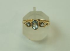 A 9 carat gold three stone aquamarine ring, finger size N, 1.