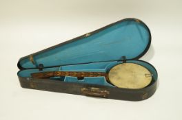 A rare and unusual banjo with Tunbridgeware neck and panels on a rosewood ground,