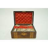 A Victorian walnut work box with parquetry inlay, the interior cover silk lined 14 cm high 30.
