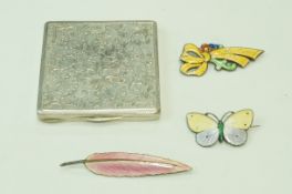 An enamel butterfly brooch, stamped 'Sterling'; an enamel feather brooch,