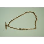 A 9ct gold watch chain, of graduated solid curb links, with a T bar and a swivel, 40 cm long, 28.