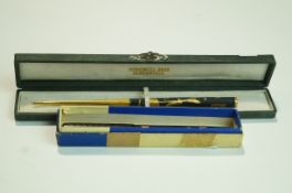 A dip pen with gilt Egyptian decoration in case, marked Pohoomull Bros Alexandria,
