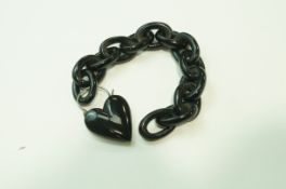 A jet bracelet, to a heart shaped padlock clasp, 18.
