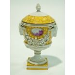 A Dresden urn and cover with gold handles and applied encrusted flowers painted marks in blue 16cm