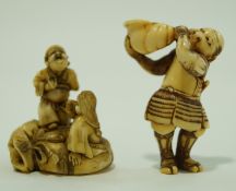 Two early 20th century Japanese carved ivory netsuke,