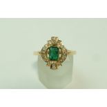 An emerald and diamond ring,