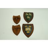 Two hand painted Oxford University wall plaques,