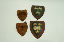 Two hand painted Oxford University wall plaques,