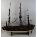 A scratch model of the Victory, with cannons presented, on ebonised stands, 100cm high,