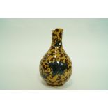 A Wedgwood pottery vase with a bulbous body and slender neck,