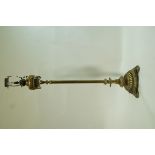 A Victorian brass oil lamp with reeded stem and round base on three round feet, overall 155.