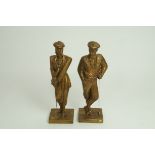 A pair of mid 20th century gilt painted model of a male and female golfer,