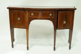 An early 19th century mahogany satinwood cross banded sideboard,
