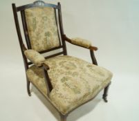 An early 20th century rosewood and string inlaid salon armchair, with upholstered seat,