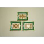 A set of three Hermes porcelain ash trays, each painted with stylised leaves,