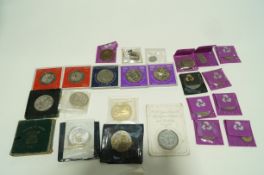 A small collection of coins including an 1889 American silver dollar