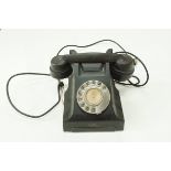 A Bakelite telephone in black by Siemens London,