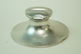A large silver Capstan inkwell, Birmingham 1905, hinged cover recessed for a pen rest, loaded, 14.
